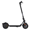 A black Ninebot F2 Kick-Scooter by Segway with its kickstand extended and visible rear-wheel drive system.